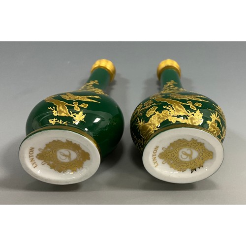 1225 - A pair of Lynton porcelain tear-shaped scent bottles, the green grounds applied with gilt and tooled... 