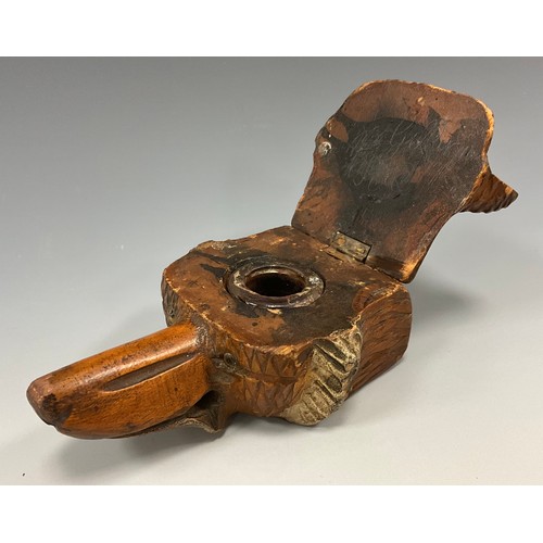 1509 - A 19th century Black Forest novelty inkwell, carved as the head of a Fox, applied eyes, 12cm long.