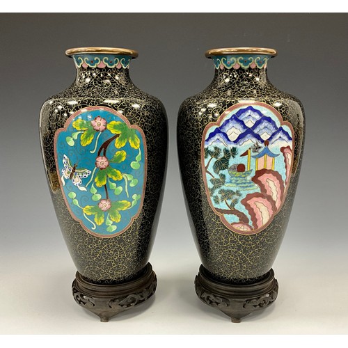 1422 - A pair of Chinese cloisonné enamel vases, of shouldered tapering form, flared rims above ruyi border... 