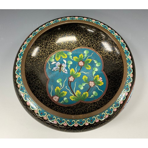 1389 - A Chinese cloisonné enamel fruit bowl, inverted rim above a ruyi border, the central well with a but... 