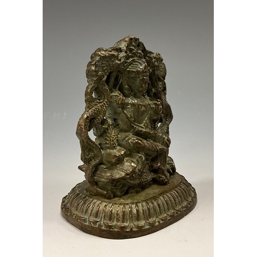 1704 - A 19th century Indian cabinet bronze, as a female Buddha, she sits on a Foo Dog flanked by a pair of... 