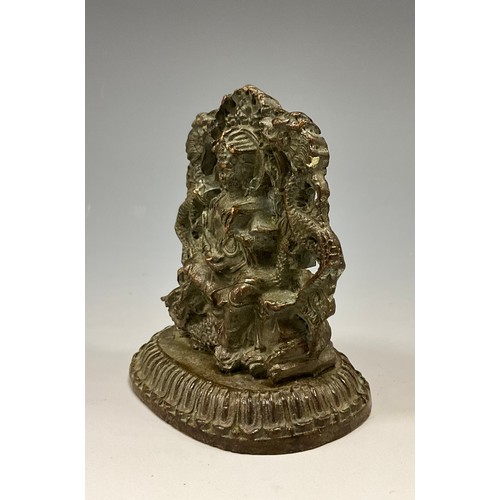 1704 - A 19th century Indian cabinet bronze, as a female Buddha, she sits on a Foo Dog flanked by a pair of... 