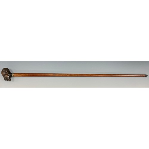 1754 - A Victorian figural walking stick, the pommel carved as a man of African descent, glass eyes, silver... 