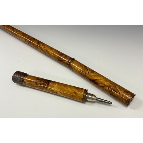 1756 - A Victorian novelty three piece walking stick, as a writing pen, the copper pommel enclosing an inkw... 