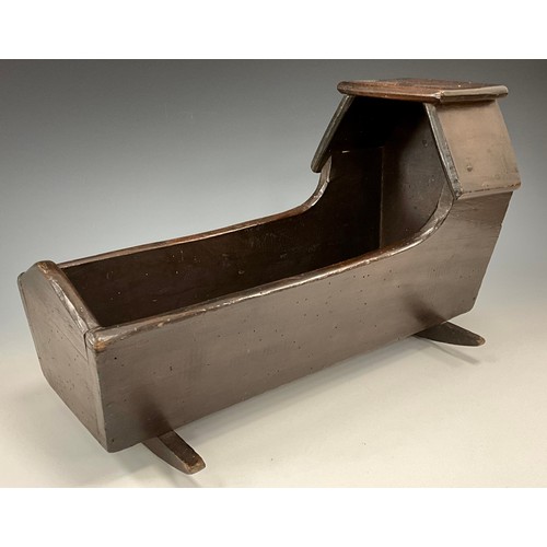 1561 - Folk Art - a 19th century mahogany rocking cradle or crib, of naive form, canted canopy, 43cm long, ... 