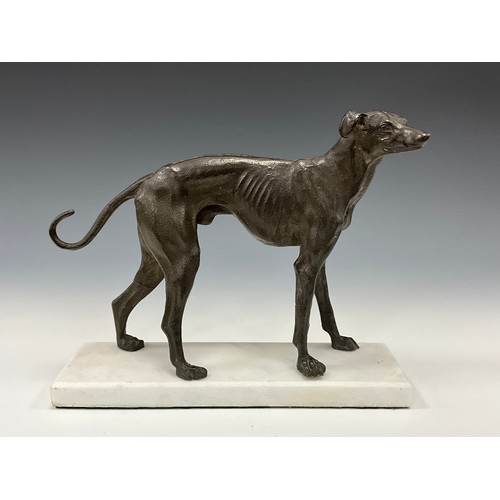 1643 - A dark patinated bronze, of a greyhound in trian aspect, rectangular marble base, 23cm high, 27cm lo... 