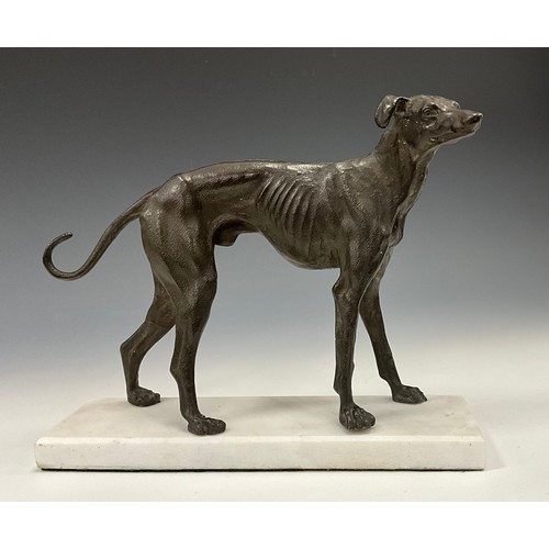 1643 - A dark patinated bronze, of a greyhound in trian aspect, rectangular marble base, 23cm high, 27cm lo... 