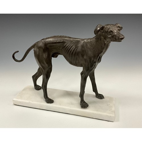 1643 - A dark patinated bronze, of a greyhound in trian aspect, rectangular marble base, 23cm high, 27cm lo... 