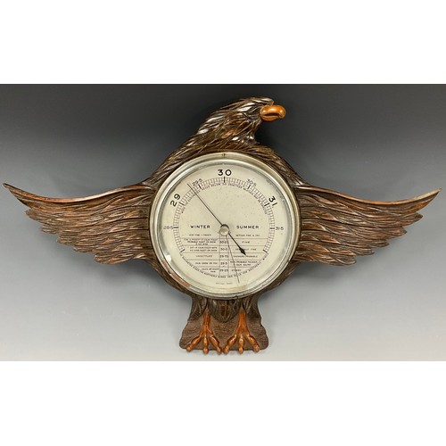 1934 - A George V barometer, the case carved as an eagle with wings displayed and lowered, silver coloured ... 