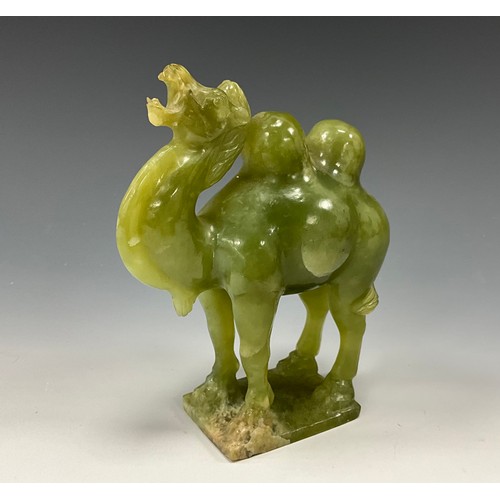 1407 - A Chinese spinach jade carving, of a Bactrian camel, statant with rearing head, rectangular base, 15... 