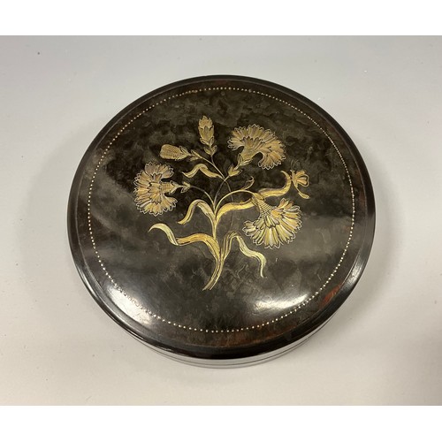 1870 - A Victorian tortoiseshell and pique pill box, the push close cover applied with flowerheads in silve... 