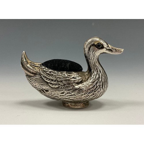 323 - A Victorian sterling silver novelty pin cushion, as a duck, applied eyes, 4cm high