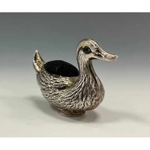 323 - A Victorian sterling silver novelty pin cushion, as a duck, applied eyes, 4cm high