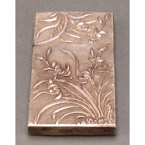 353 - A Chinese silver rectangular visiting card case, chased with lilies and prunus on a textured ground,... 