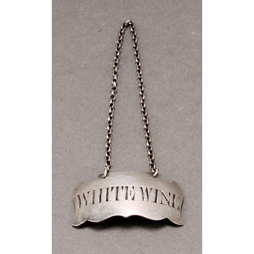 112 - A 19th century silver coloured metal cartouche shaped wine label, White Wine, 4.5cm wide, apparently... 