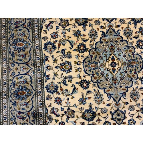 2056 - A Central Persian Kashan carpet, the diamond-shaped medallion within a field of stylised flowers, in... 