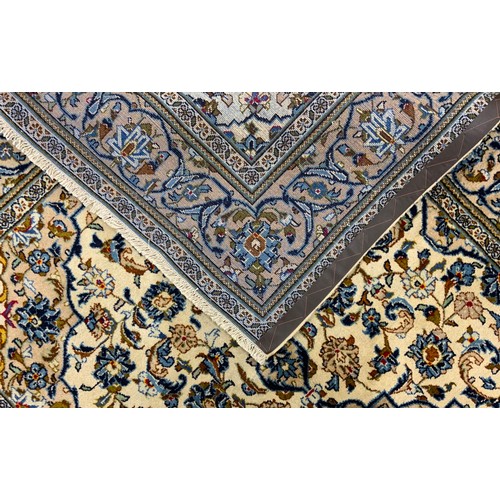 2055 - A Central Persian Kashan carpet, central Navette-shaped medallion within a field of stylised scrolli... 