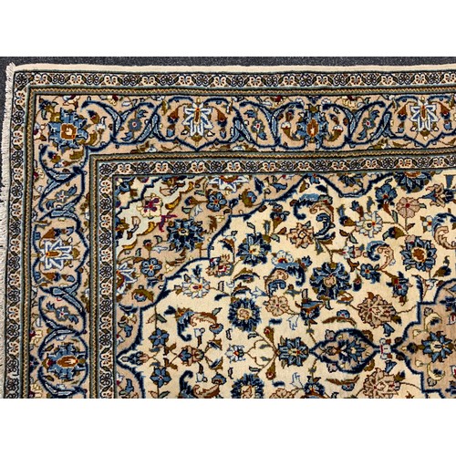 2055 - A Central Persian Kashan carpet, central Navette-shaped medallion within a field of stylised scrolli... 