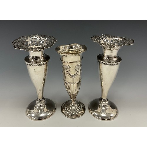 196 - A pair of late Victorian silver posy vases, pierced floral lip with tapering body, weighted foot, Wi... 