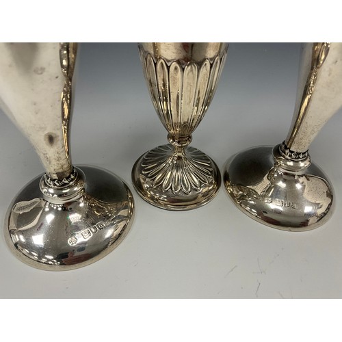 196 - A pair of late Victorian silver posy vases, pierced floral lip with tapering body, weighted foot, Wi... 