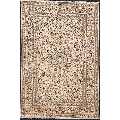 2070 - A Kashan rug, knotted with a central lotus-form medallion within a field of stylised scrolling flora... 