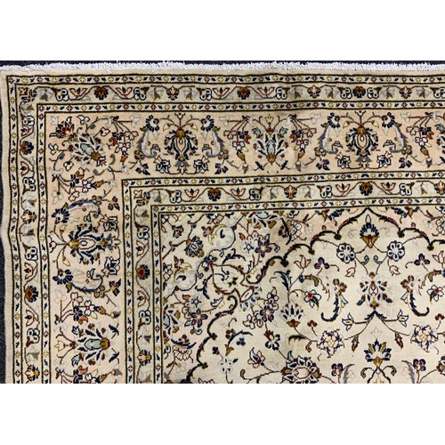 2070 - A Kashan rug, knotted with a central lotus-form medallion within a field of stylised scrolling flora... 