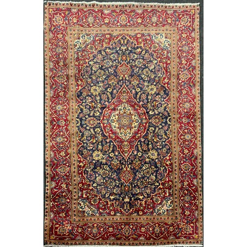 2069 - A Kashan rug, knotted with a central Nanette-shaped medallion within a densely woven field of stylis... 