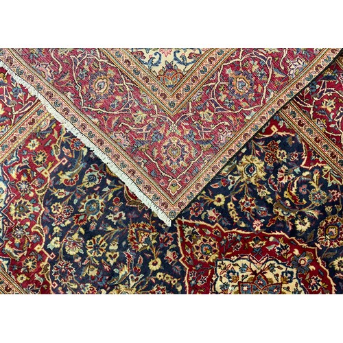 2069 - A Kashan rug, knotted with a central Nanette-shaped medallion within a densely woven field of stylis... 