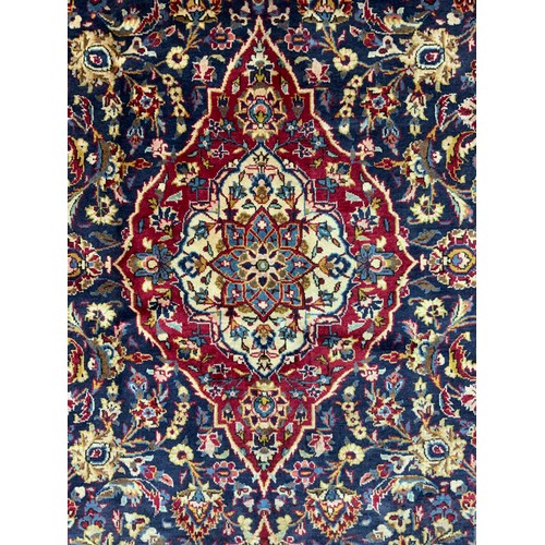 2069 - A Kashan rug, knotted with a central Nanette-shaped medallion within a densely woven field of stylis... 