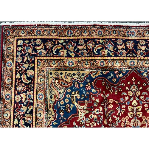 2072 - A Tabriz rug, central lotus-form medallion within a field of stylised floral motifs, in rich tones o... 