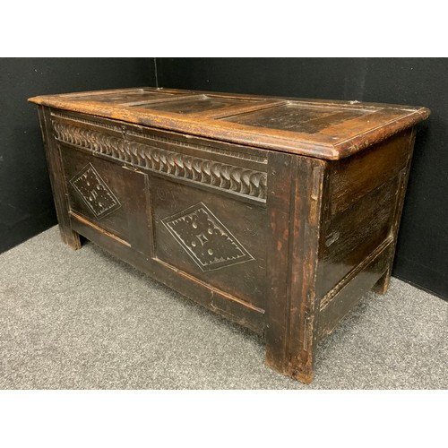 1629 - An 18th century oak blanket chest, moulded top enclosing an open till over a deep carved frieze, abo... 