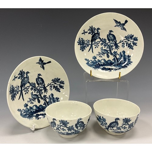 1319 - A pair of early Worcester Porcelain Tea Bowls and Saucers, blue and white Birds in Branches pattern,... 