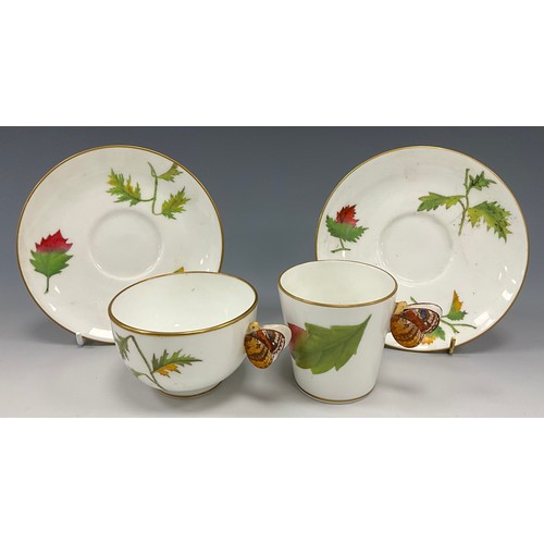 1210 - A late 19th century Minton tea cup and saucer, transfer print of autumnal foliage, moulded butterfly... 