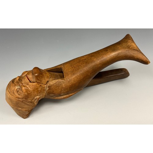 2052 - A 19th century novelty nutcracker carved as an old man in night cap, 21cm long