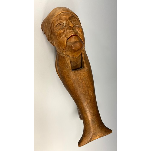 2052 - A 19th century novelty nutcracker carved as an old man in night cap, 21cm long