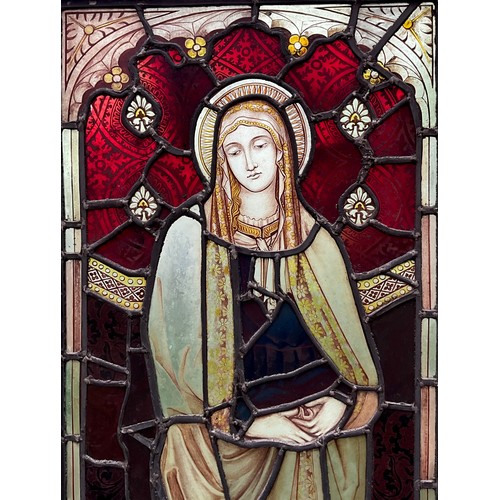 2053 - A Church stained glass window panel, The Blessed Virgin Mary, standing haloed, downcast gaze, 117cm ... 