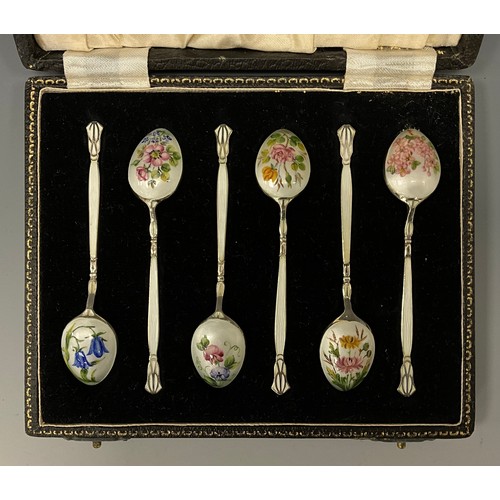 400 - A set of six Elizabeth II enamelled silver spoons, each back decorated with botanical studies of Blu... 