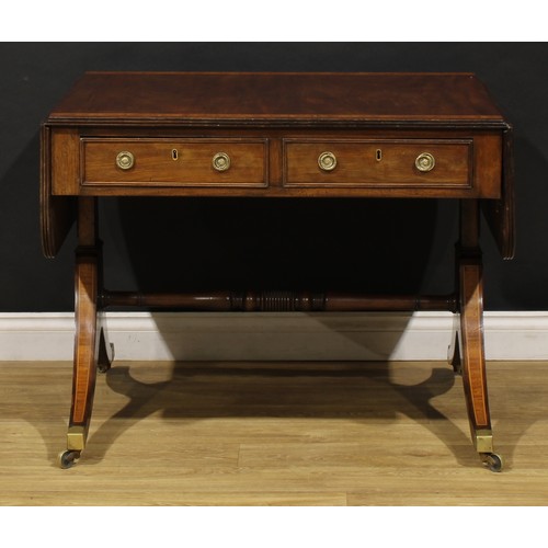 2128 - A Post-Regency tulipwood crossbanded mahogany sofa table, rounded rectangular top with channelled ed... 