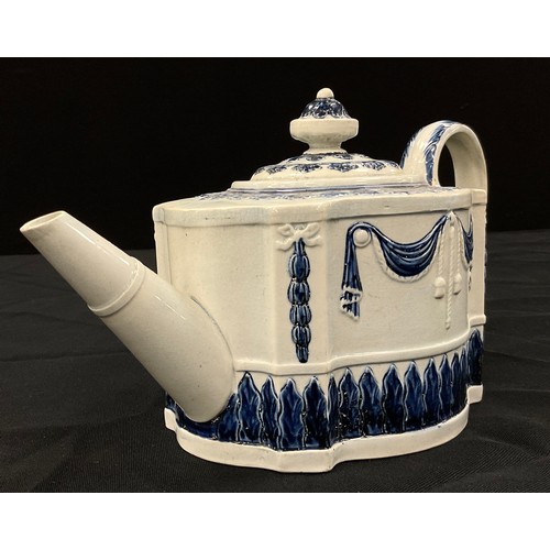 1205 - A Hawley blue and white pearlware teapot, in the commode shape, moulded in relief with linen swags a... 