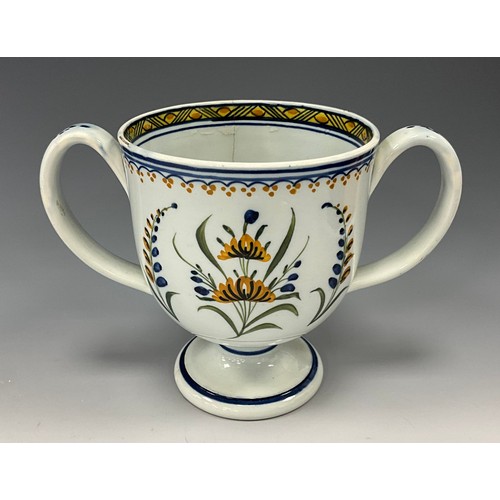 1209 - A late 18th century Prattware loving cup, inscribed  ‘Thos Afhmower.1795’, 13cm high