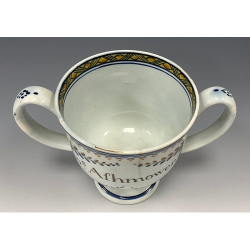 1209 - A late 18th century Prattware loving cup, inscribed  ‘Thos Afhmower.1795’, 13cm high