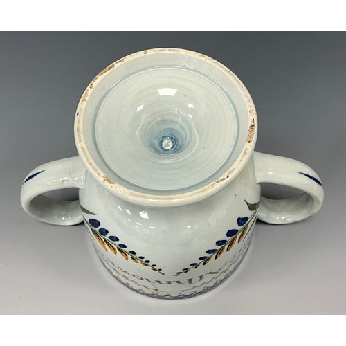 1209 - A late 18th century Prattware loving cup, inscribed  ‘Thos Afhmower.1795’, 13cm high