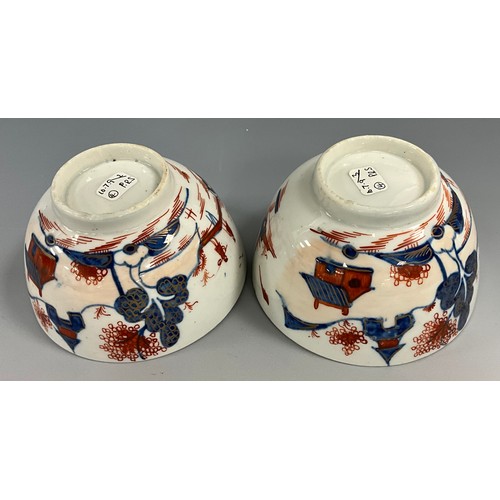 1223 - A pair of Lowestoft tea bowls, painted in the Imari palette with chinoiserie landscapes, 19cm diamet... 