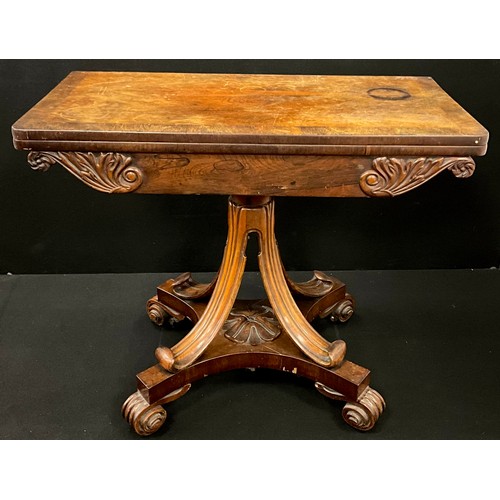 1913 - A William IV Rosewood card table, cross-banded fold-over top, with carved frieze, raised on a carved... 