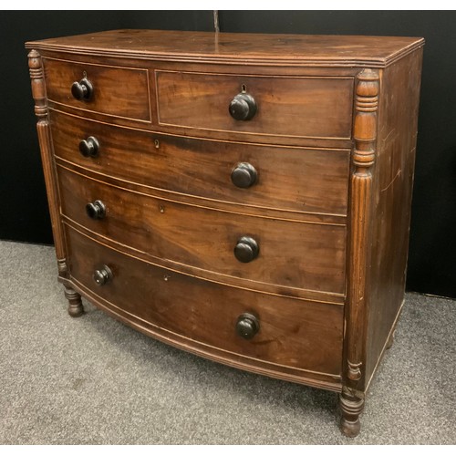 2132 - A Regency mahogany bow front chest, slightly oversailing top with reeded edge above two short above ... 