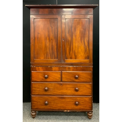 1784 - A Victorian mahogany cabinet on chest, oversailing top above a pair of flame veneered doors enclosin... 