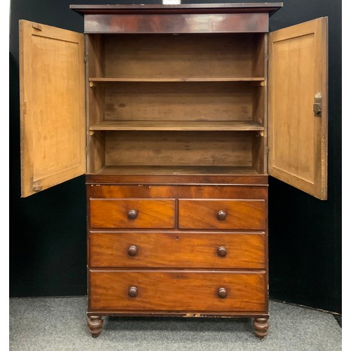 1784 - A Victorian mahogany cabinet on chest, oversailing top above a pair of flame veneered doors enclosin... 