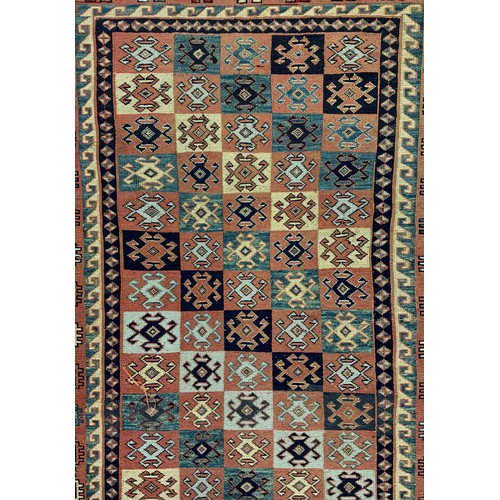 2059 - A Middle Eastern/Persian Kilim rug, knotted with a geometric pattern in alternating colours, blue, b... 