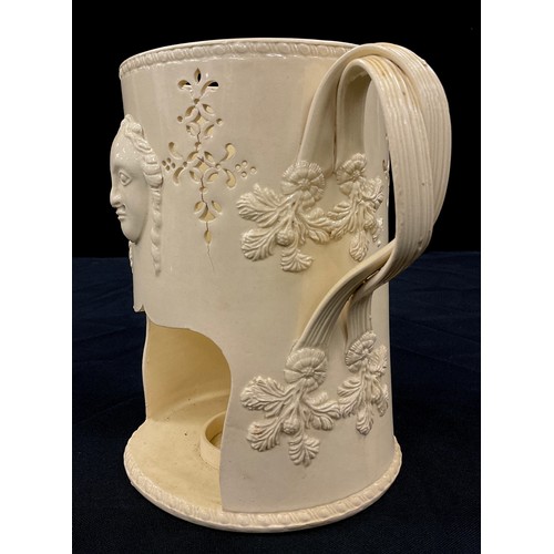 1170 - A 18th century creamware food warmer, cylindrical body with moulded figural masks, berries and fruit... 