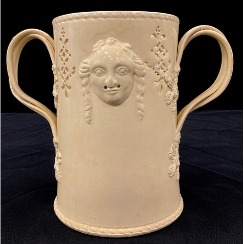 1170 - A 18th century creamware food warmer, cylindrical body with moulded figural masks, berries and fruit... 